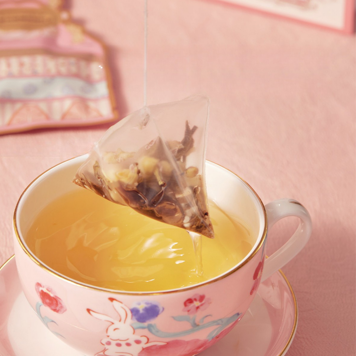 Tea Showcase No.7 pyramid tea bag brewing in a cup