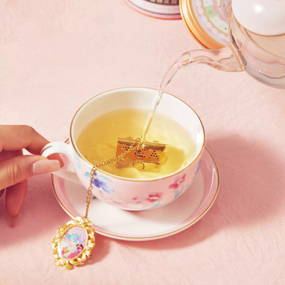 Fifth Avenue Tea Street tea infuser brewing in a cup